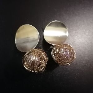 Metal earrings with a white pearl